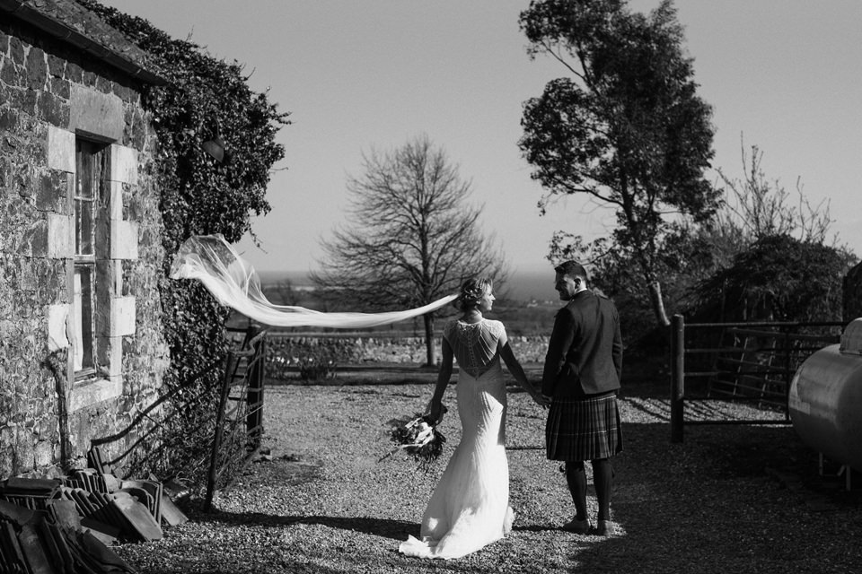 flying veil during couple shoot