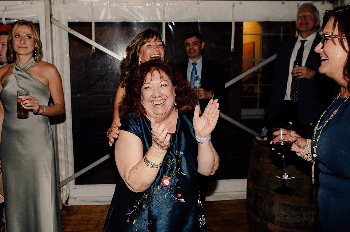 Wedding guests dancing in the marquee at the Thirlestane Castle.