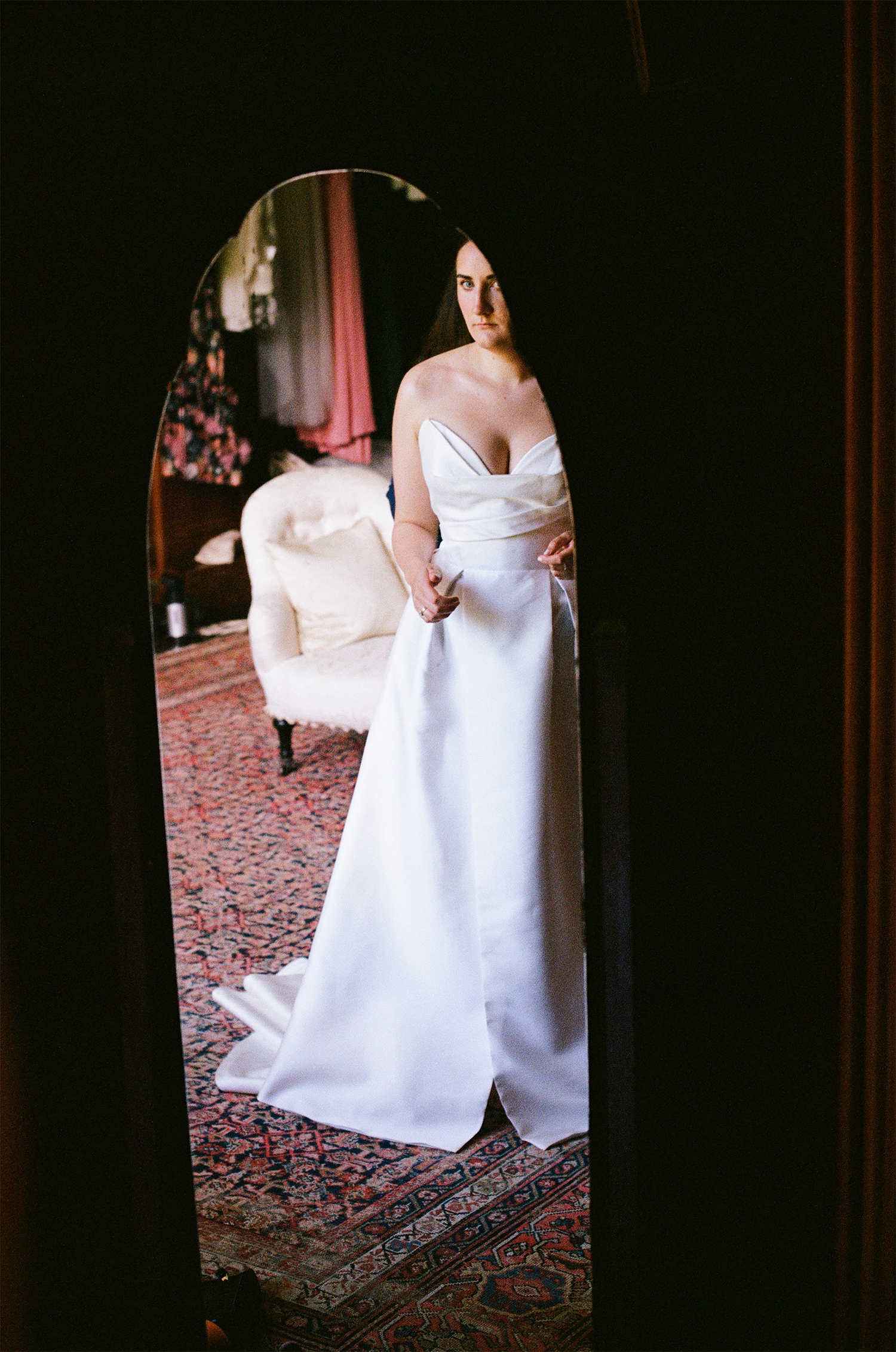 Lucy posing in her wedding dress for analogue photography in the UK.