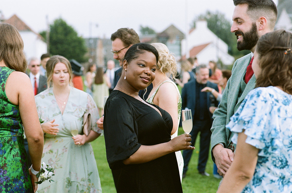 Wedding guests enjoying outdoor drinks reception in Aberlady.